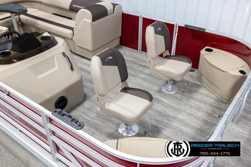 Slide: The Image of 2025 Bennington 188 SSSE pontoon boat interior with beige seating and red accents. - 9