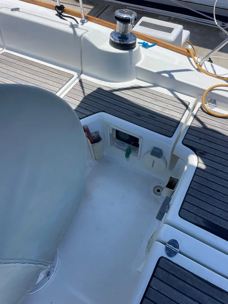 Slide: The Image of 2010 Beneteau Oceanis 37 yacht cockpit with winch and teak decking. - 26