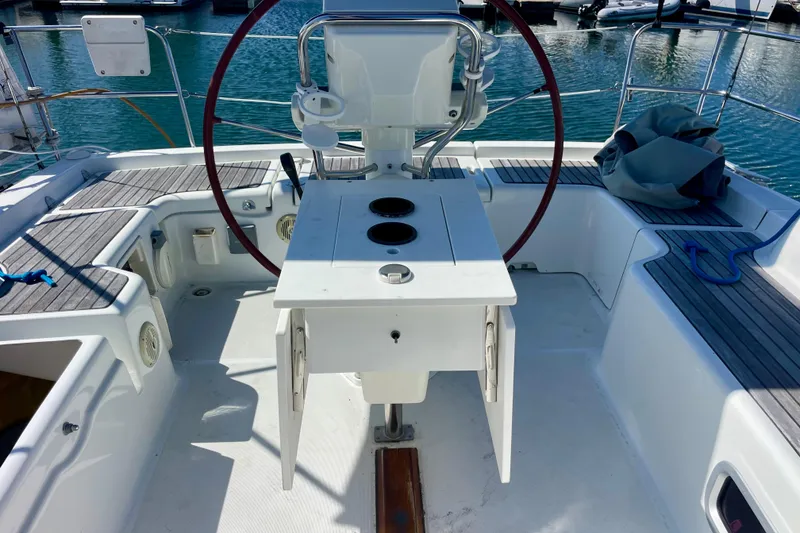 Slide: The Image of Cockpit of 2010 Beneteau Oceanis 37 sailboat with steering wheel and seating. - 38