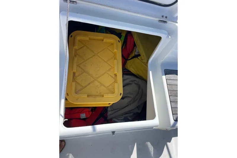 Slide: The Image of Storage compartment on a 2010 Beneteau Oceanis 37 sailboat with yellow container. - 39