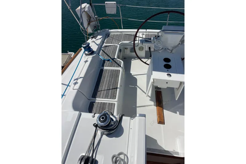 Slide: The Image of 2010 Beneteau Oceanis 37 yacht cockpit with steering wheel and winches. - 43