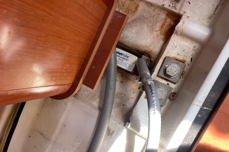 Slide: The Image of Interior view of 2010 Beneteau Oceanis 37 showing bilge pump and wiring. - 53