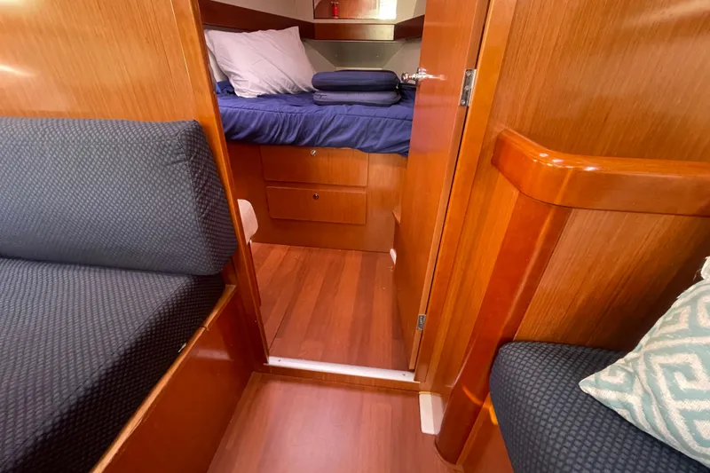 Slide: The Image of Interior of 2010 Beneteau Oceanis 37 sailboat with cozy cabin and wooden finish. - 55