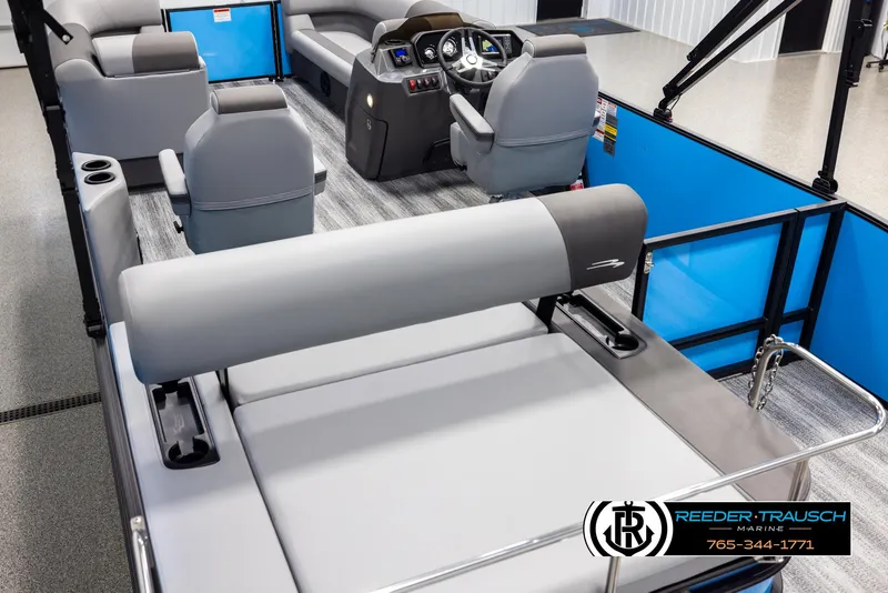 Slide: The Image of 2025 Bennington 23 SSBSE pontoon boat interior with modern seating and helm. - 11