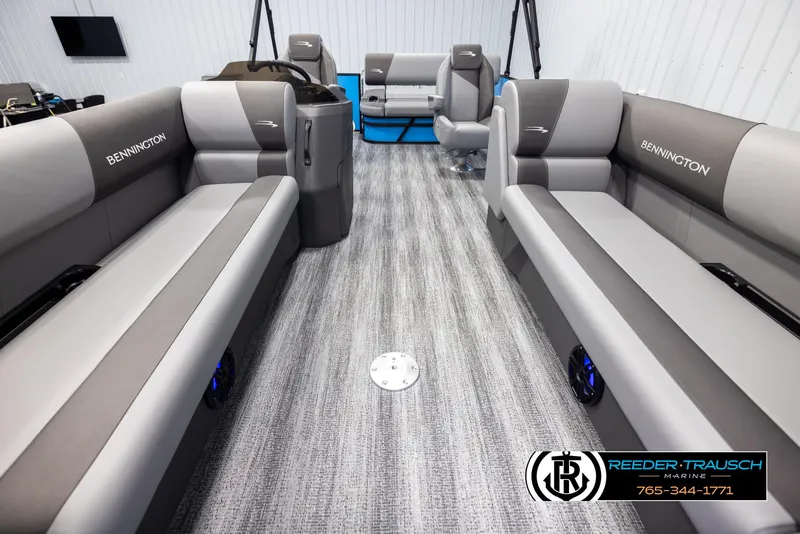 Slide: The Image of 2025 Bennington 23 SSBSE pontoon boat interior with gray seating and modern design. - 13
