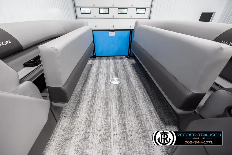 Slide: The Image of 2025 Bennington 23 SSBSE pontoon boat interior with gray seating and carpeted flooring. - 19