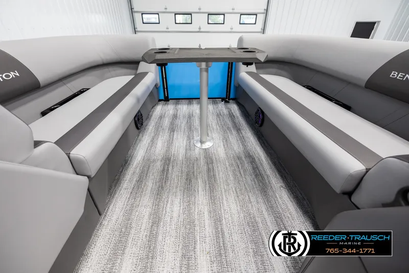 Slide: The Image of Interior of 2025 Bennington 23 SSBSE pontoon boat with gray seating and table. - 20