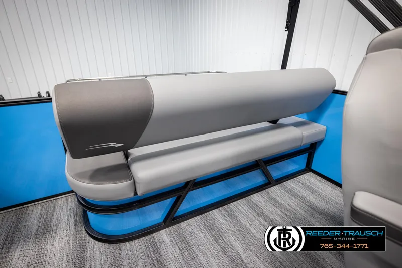 Slide: The Image of 2025 Bennington 23 SSBSE boat seating with gray upholstery and blue accents. - 22