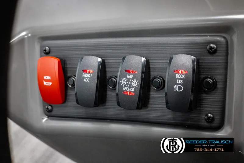 Slide: The Image of Control panel of 2025 Bennington 23 SSBSE with horn, radio, navigation, and dock light switches. - 26