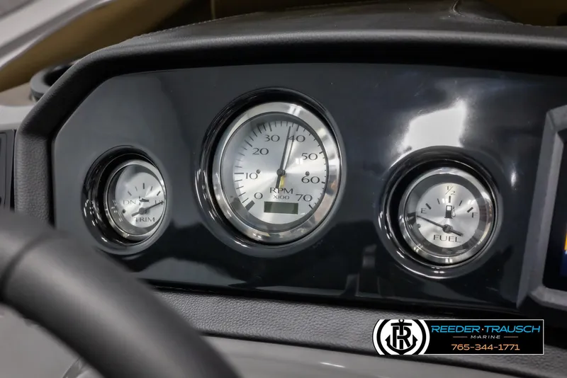 Slide: The Image of Dashboard of 2025 Bennington 23 SSBSE with RPM, trim, and fuel gauges. - 28