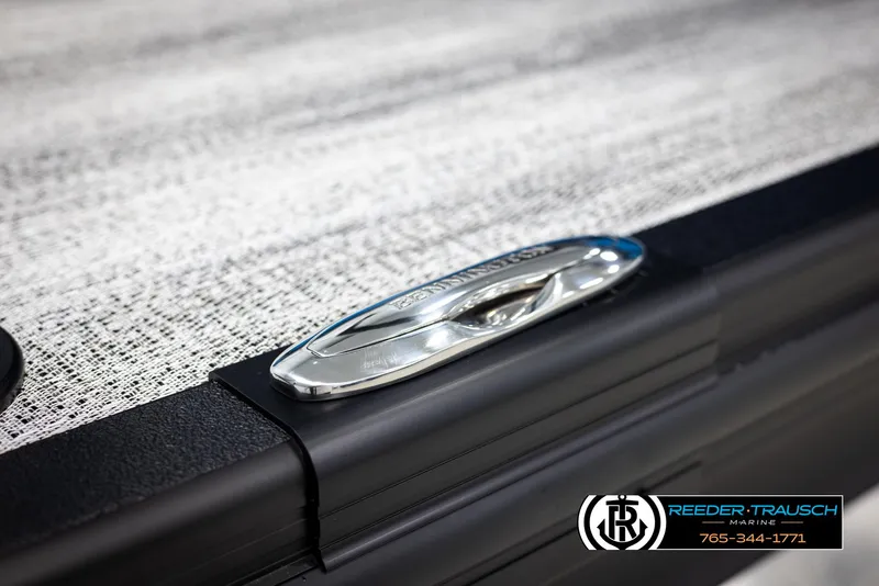 Slide: The Image of 2025 Bennington 23 SSBSE boat detail with sleek chrome cleat, Reeder-Trausch Marine branding. - 45
