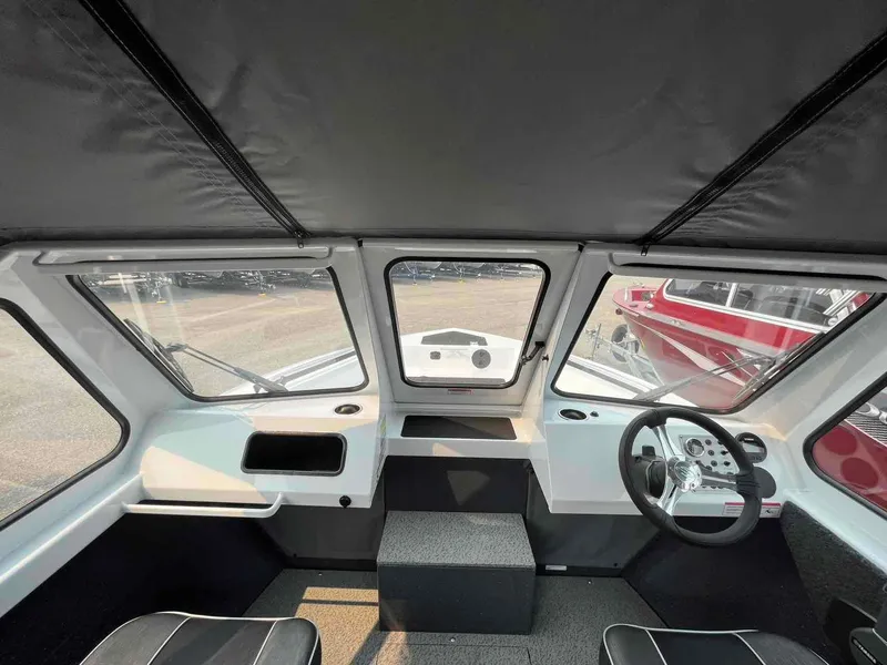 Slide: The Image of 2024 Duckworth 18 ADV XT boat interior with steering wheel and dashboard. - 10