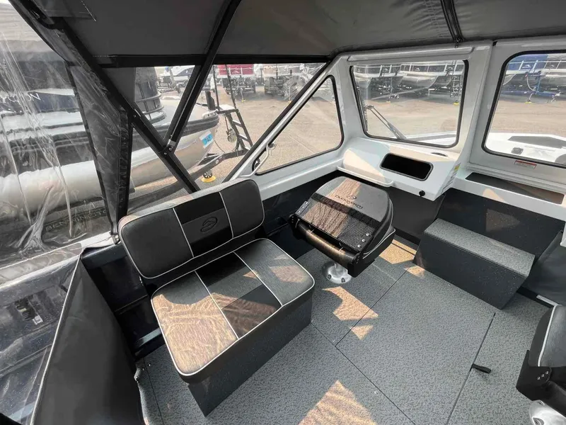 Slide: The Image of Interior of 2024 Duckworth 18 ADV XT boat with seating and helm area. - 5