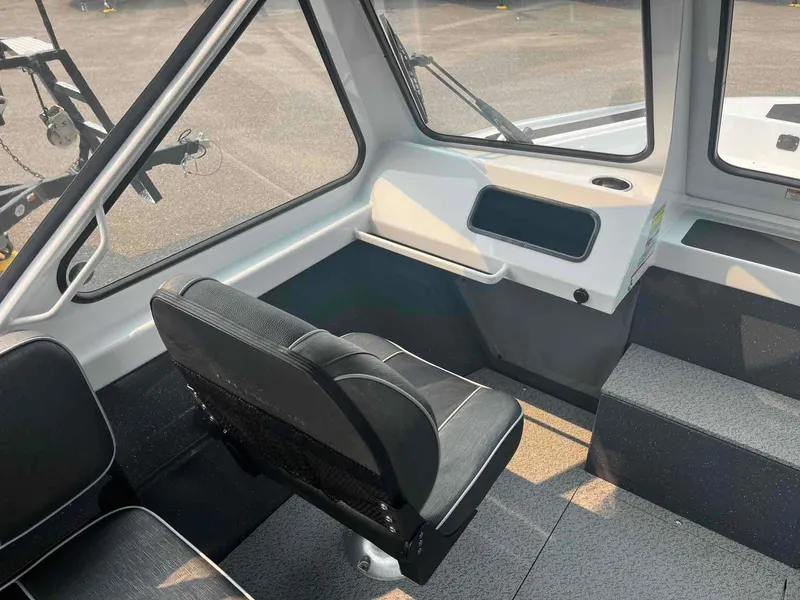 Slide: The Image of 2024 Duckworth 18 ADV XT boat interior with seating and dashboard view. - 6