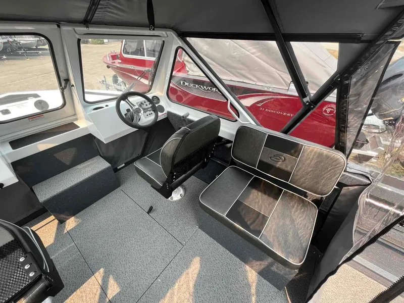 Slide: The Image of Interior of 2024 Duckworth 18 ADV XT boat with seating and steering wheel. - 7