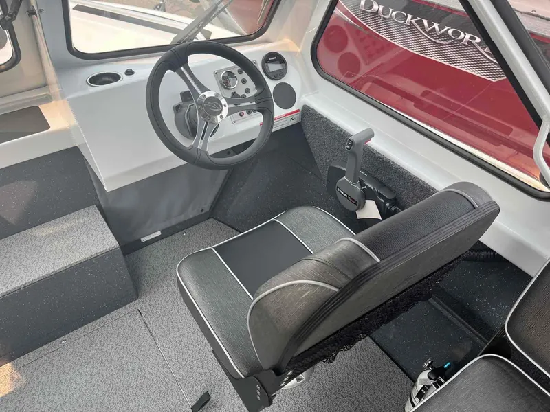 Slide: The Image of 2024 Duckworth 18 ADV XT boat interior with steering wheel and seating. - 8