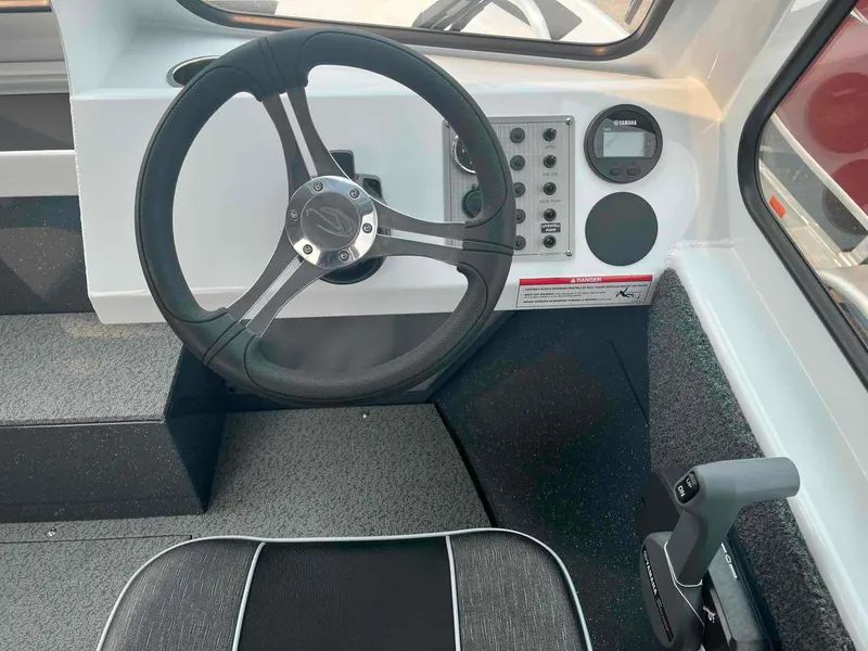 Slide: The Image of 2024 Duckworth 18 ADV XT boat cockpit with steering wheel and control panel. - 9
