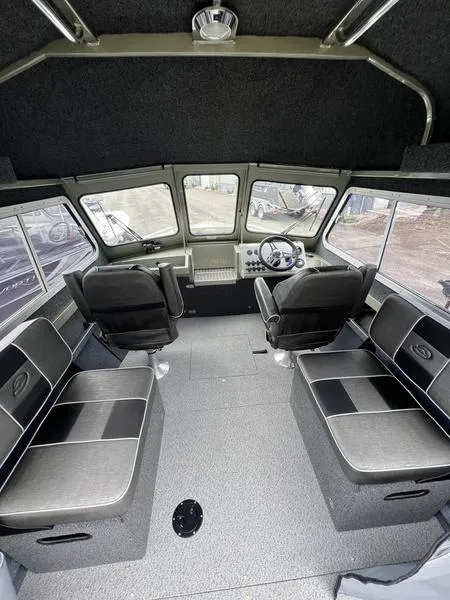 Slide: The Image of 2023 Duckworth 20 NAV SPT boat interior with seating and steering console. - 10