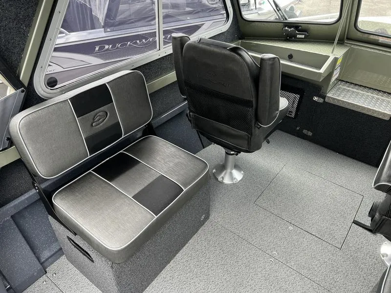 Slide: The Image of Interior of 2023 Duckworth 20 NAV SPT boat with seating and helm area. - 11