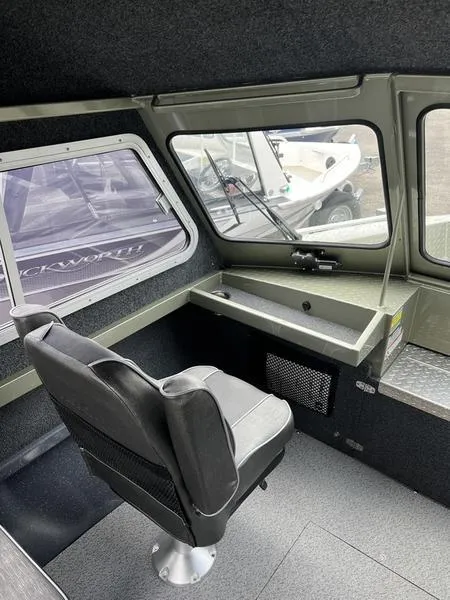 Slide: The Image of Interior of 2023 Duckworth 20 NAV SPT boat with seating and dashboard. - 12
