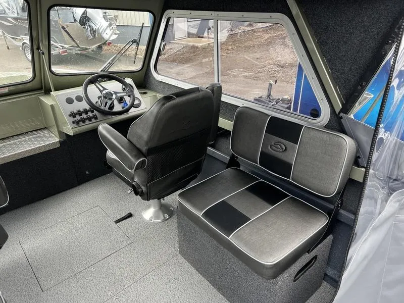 Slide: The Image of Interior of 2023 Duckworth 20 NAV SPT boat with steering wheel and seating. - 13