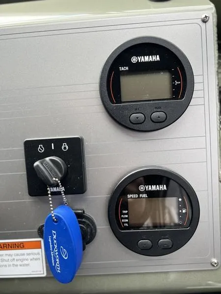 Slide: The Image of Control panel of 2023 Duckworth 20 NAV SPT with Yamaha gauges and ignition key. - 15