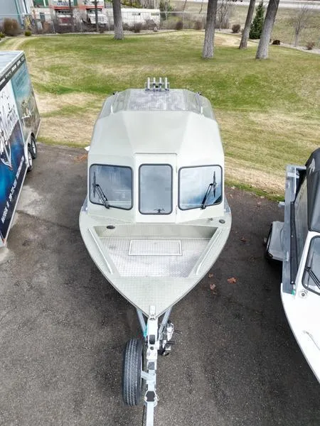 Slide: The Image of 2023 Duckworth 20 NAV SPT boat on trailer, parked on pavement. - 17