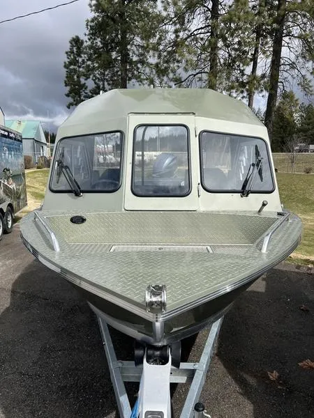 Slide: The Image of 2023 Duckworth 20 NAV SPT boat on trailer, parked outdoors. - 3