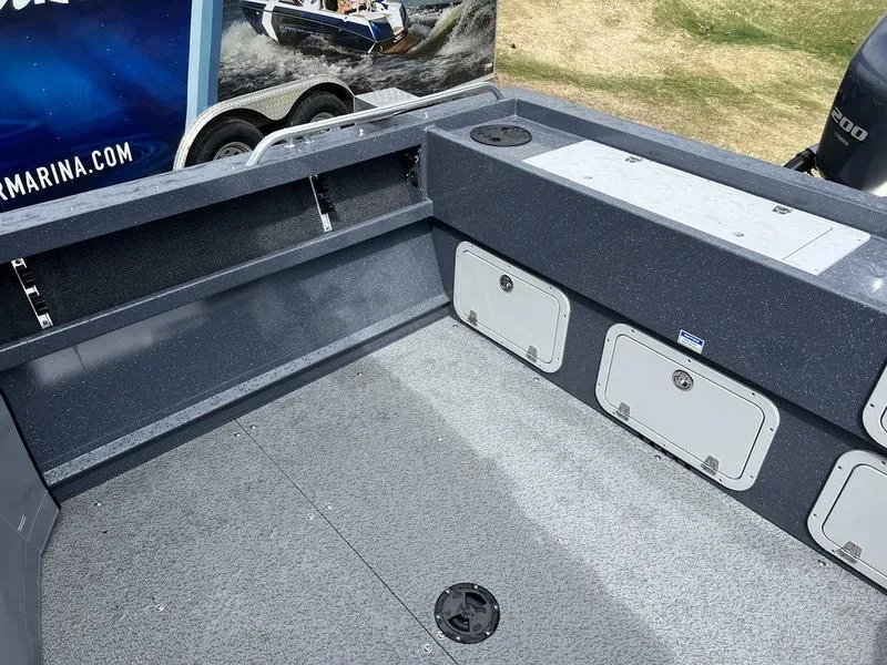 Slide: The Image of 2023 Duckworth 20 NAV SPT boat interior with storage compartments and clean deck. - 9