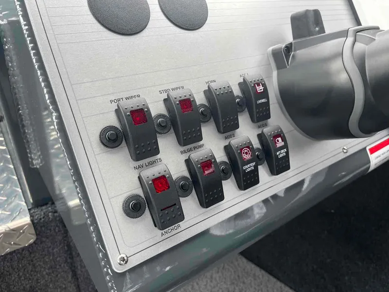 Slide: The Image of Control panel of 2024 Duckworth 20 NAV SPT boat with various switches. - 10