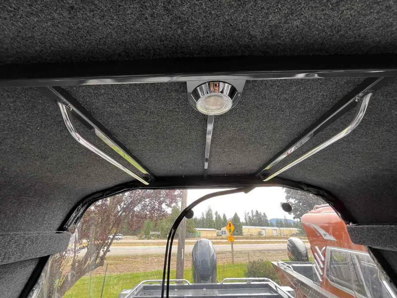 Slide: The Image of Interior view of 2024 Duckworth 20 NAV SPT boat with ceiling light and metal rails. - 13