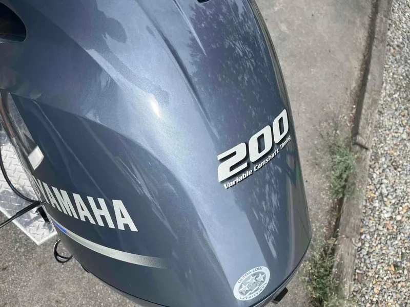 Slide: The Image of Yamaha 200 outboard motor with Variable Camshaft Timing on a 2024 Duckworth 20 NAV SPT. - 18