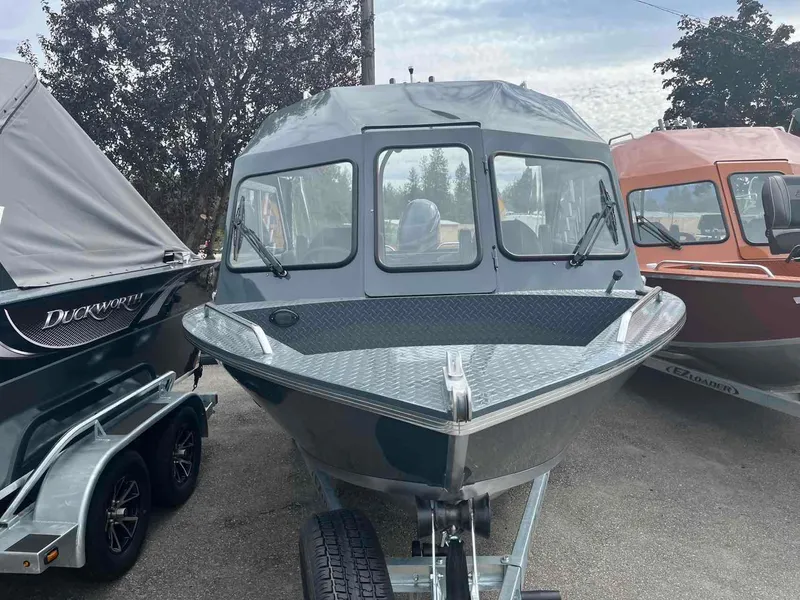 Slide: The Image of 2024 Duckworth 20 NAV SPT boat on trailer, parked outdoors. - 3