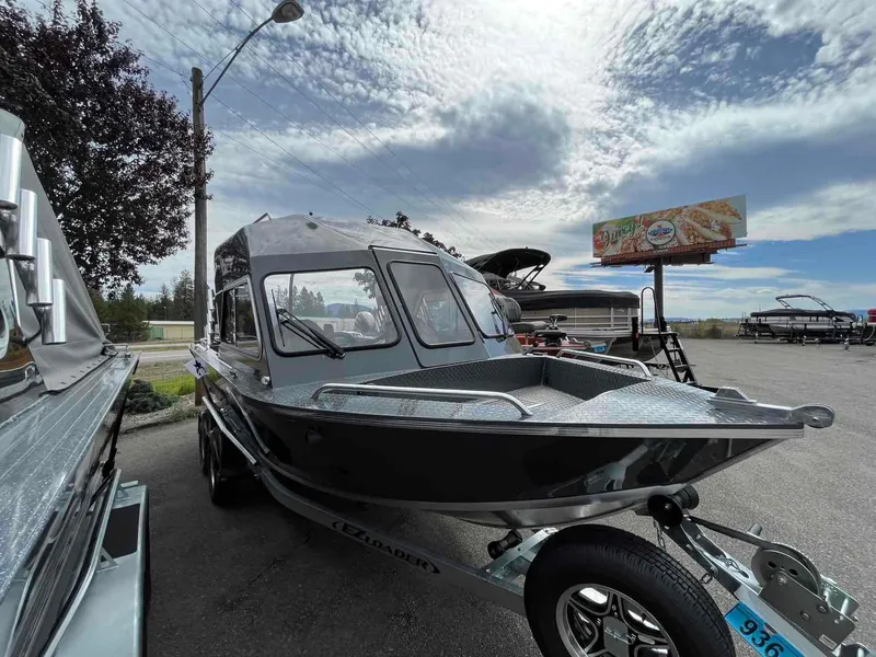 Slide: The Image of 2024 Duckworth 20 NAV SPT boat on trailer under cloudy sky. - 4