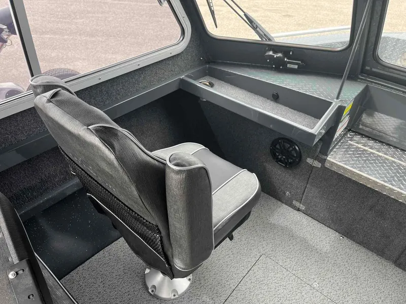 Slide: The Image of Interior of 2024 Duckworth 20 NAV SPT boat with black seating and dashboard. - 7