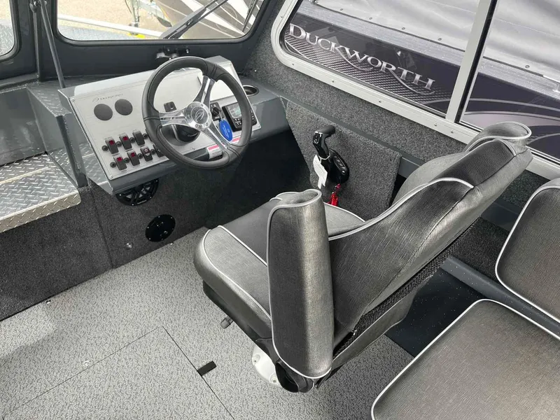 Slide: The Image of 2024 Duckworth 20 NAV SPT boat interior with steering wheel and control panel. - 8