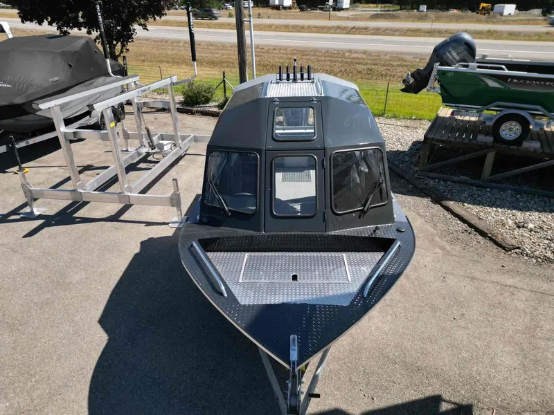 Slide: The Image of 2024 Duckworth 21 Discovery boat displayed outdoors on a sunny day. - 3