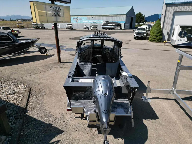 Slide: The Image of 2024 Duckworth 21 Discovery boat with outboard motor in a marina setting. - 5