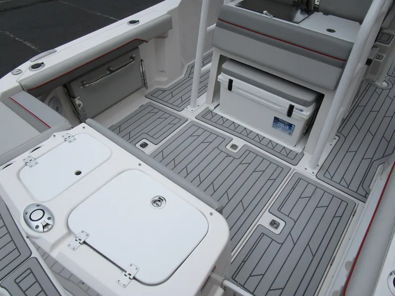 Slide: The Image of 2025 Solara S-250 CW boat interior with gray deck and storage compartments. - 12