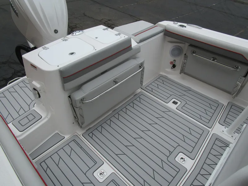 Slide: The Image of 2025 Solara S-250 CW boat deck with gray non-slip flooring and storage compartments. - 15