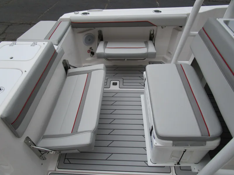 Slide: The Image of 2025 Solara S-250 CW boat interior with gray seating and red accents. - 17