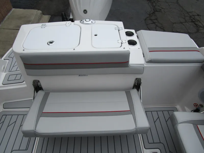 Slide: The Image of 2025 Solara S-250 CW boat seating area with storage and cup holders. - 21
