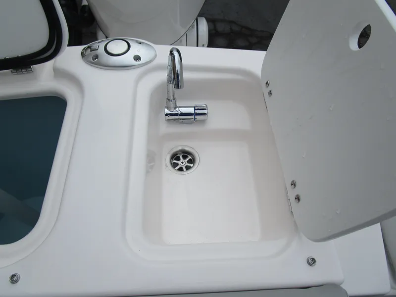 Slide: The Image of Compact sink with chrome faucet on Solara S-250 CW boat, 2025 model. - 23