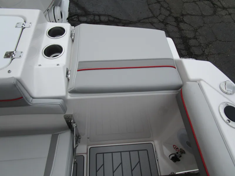 Slide: The Image of 2025 Solara S-250 CW boat interior with cup holders and cushioned seating. - 24