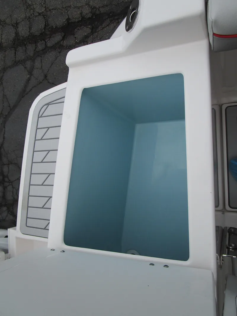 Slide: The Image of Solara S-250 CW 2025 boat storage compartment with open lid, showcasing interior space. - 25