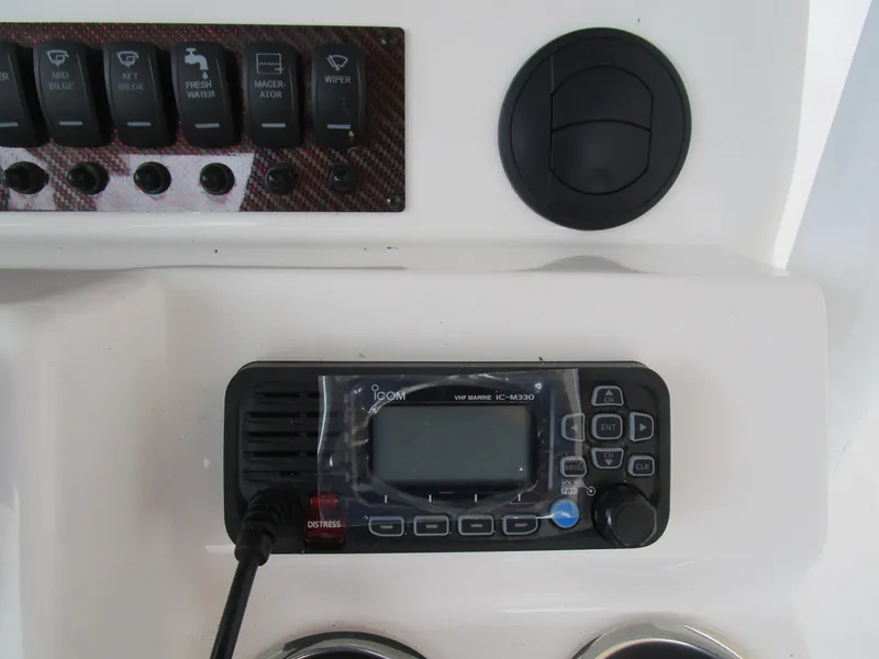 Slide: The Image of Control panel of 2025 Solara S-250 CW boat with radio and switches. - 34