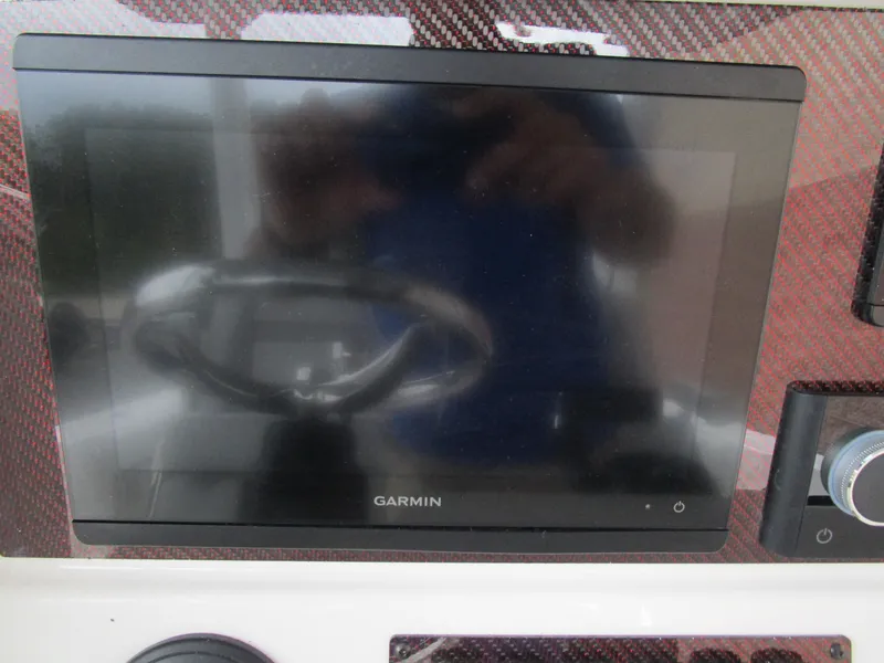 Slide: The Image of Garmin display on 2025 Solara S-250 CW dashboard with carbon fiber finish. - 35