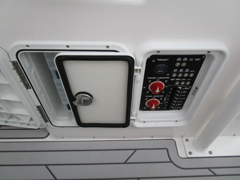 Slide: The Image of Control panel of 2025 Solara S-250 CW boat with open access hatch. - 37