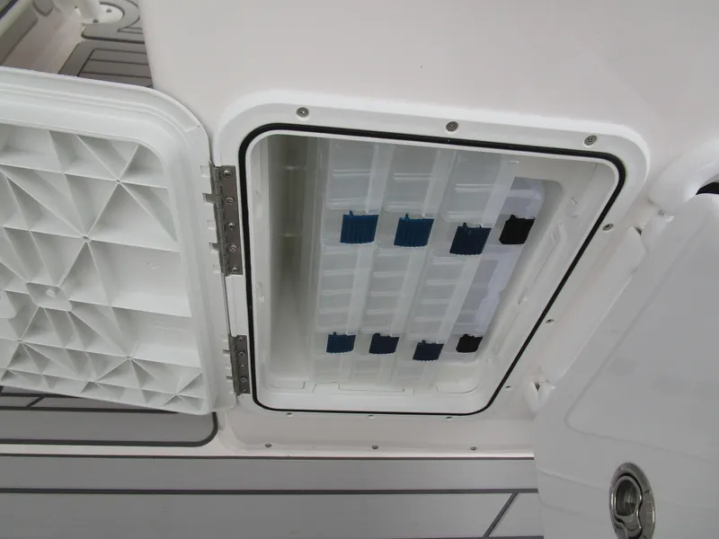 Slide: The Image of Open storage compartment on 2025 Solara S-250 CW boat. - 38