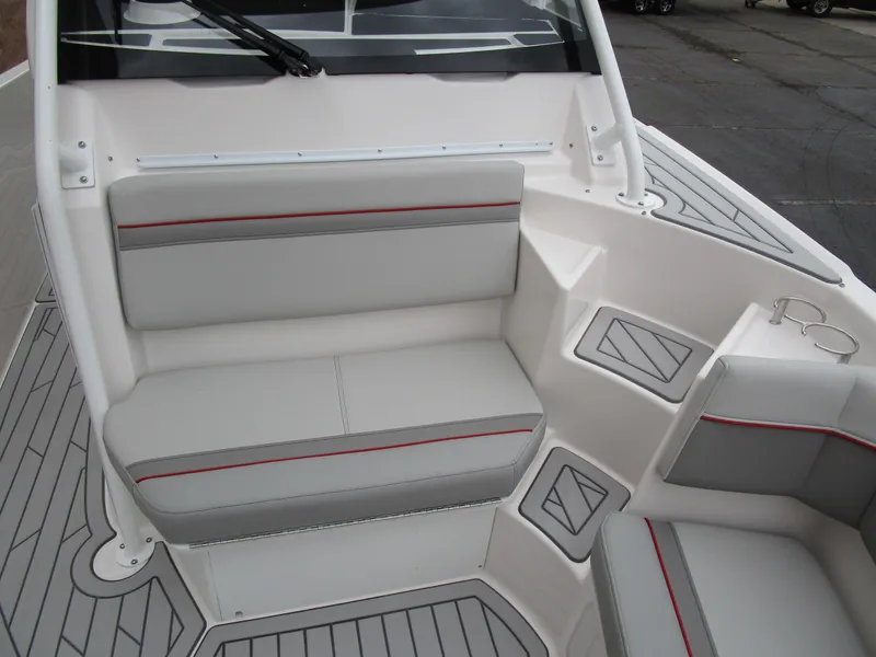 Slide: The Image of 2025 Solara S-250 CW boat interior with gray seating and red accents. - 42